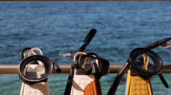 Lifeguard fins on boardwalk