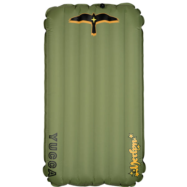 Olive green Yucca Standard Merlyn inflatable surf mat shown flat against a light gray background. Features vertical air chambers, black and gold bird logo at the top, black Yucca logo along the side, and yellow script Merlyn logo near the bottom. 