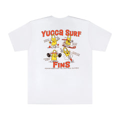 White Yucca Surf Fins t-shirt with large retro-style back graphic featuring four cartoon yellow surf fin characters illustrating “Hardest Working,” “Fastest Moving,” “Strongest Rubber,” and “Effortless Propulsion,” with orange Yucca Surf Fins lettering and “Premium Rubber Surf Fins, Costa Mesa, California” text